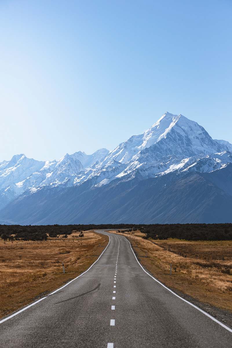 new zealand mountains covered with snow near road mount cook